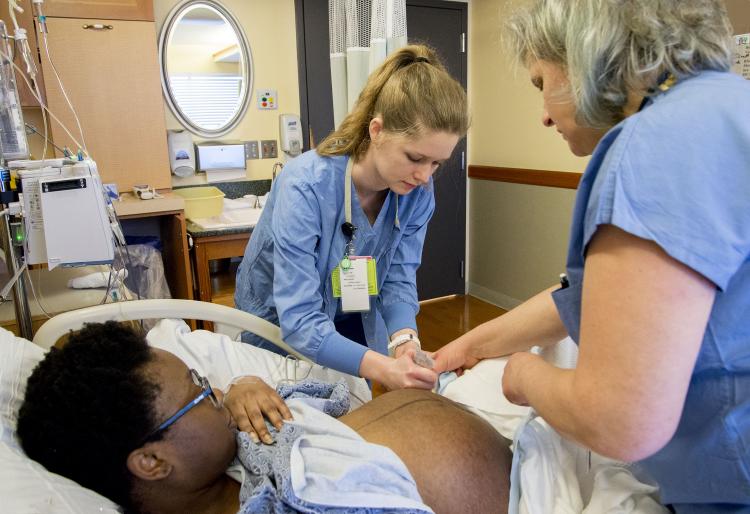 A woman receives care at the childbirth center