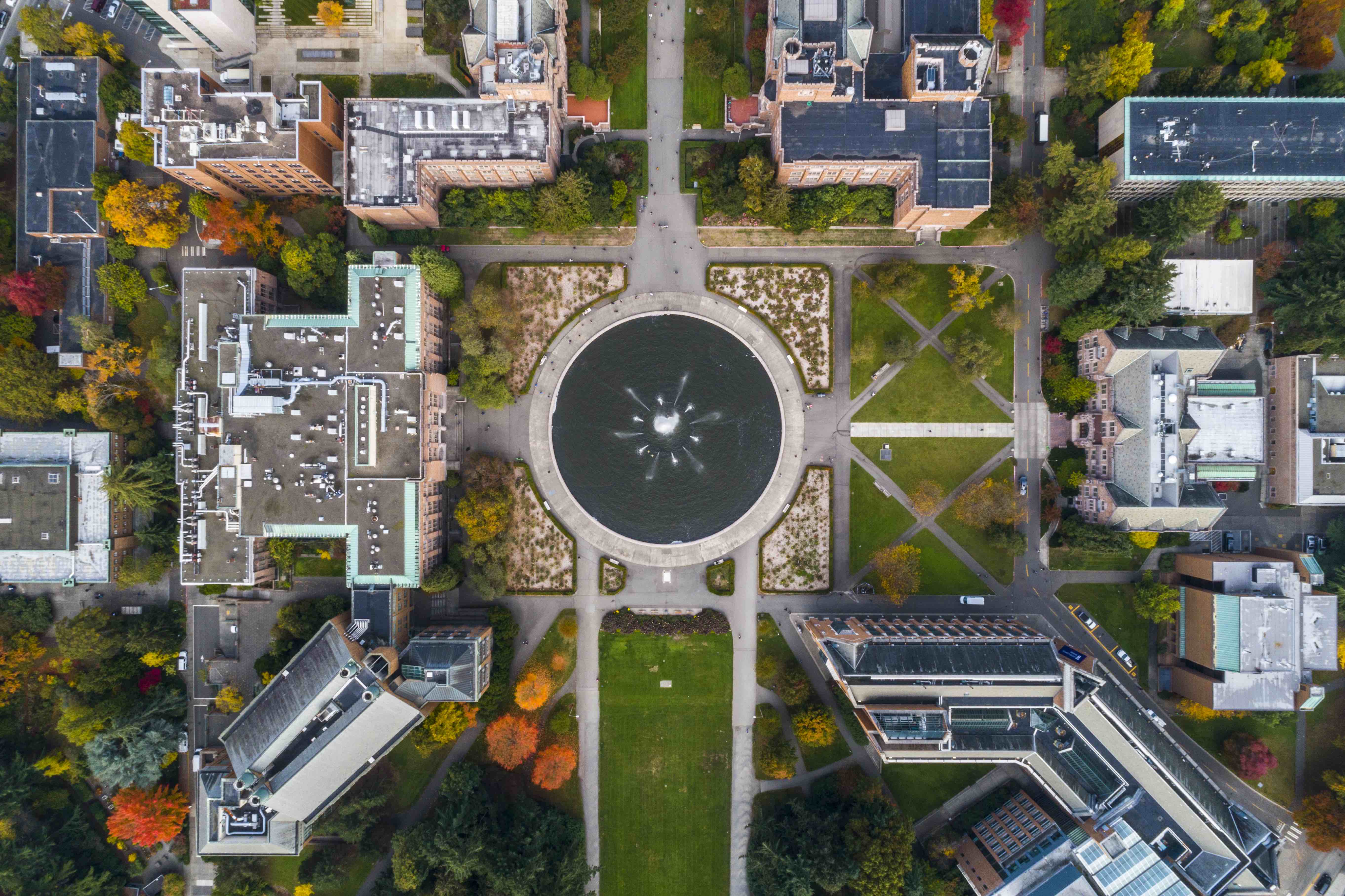 An arial view of a fountain and gothic buildings
