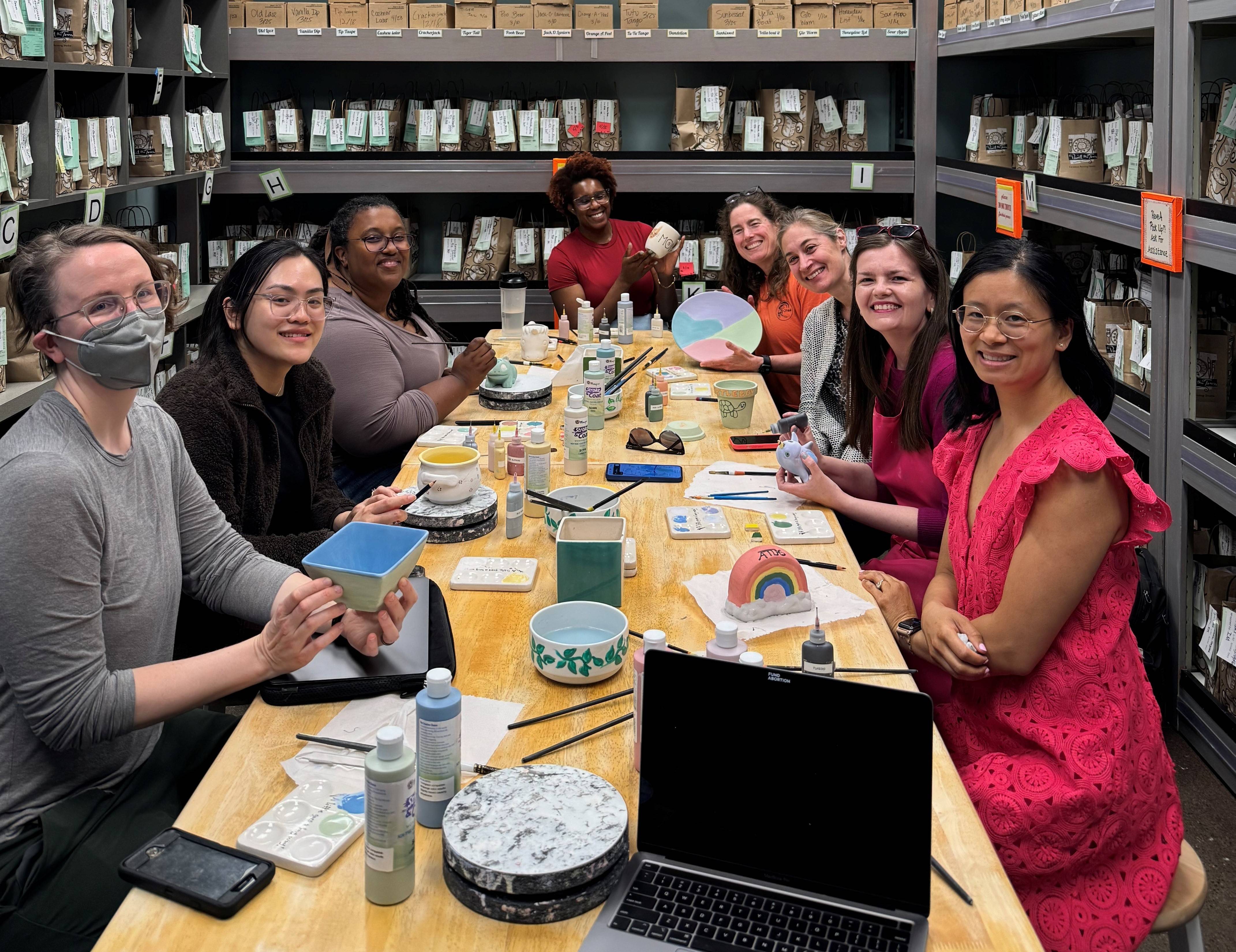 A group in a pottery shop.