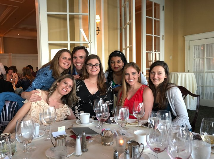The class of 2021 smiles and gathers together at a dinner